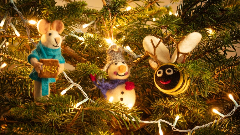 A bee, snowman and singing mouse Christmas tree decorations